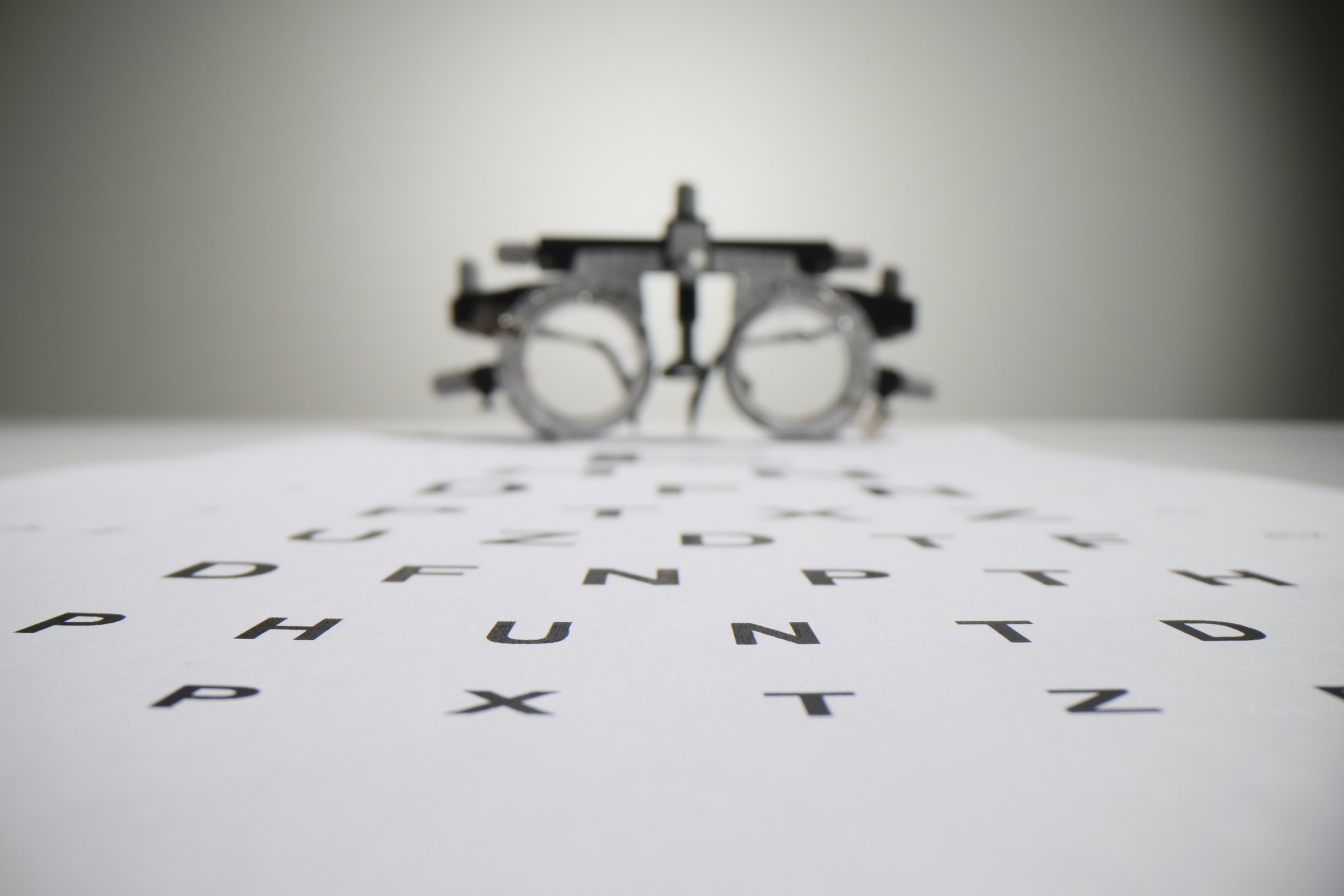 Snellen Chart Letters against Blurred Ophthalmology Goggles